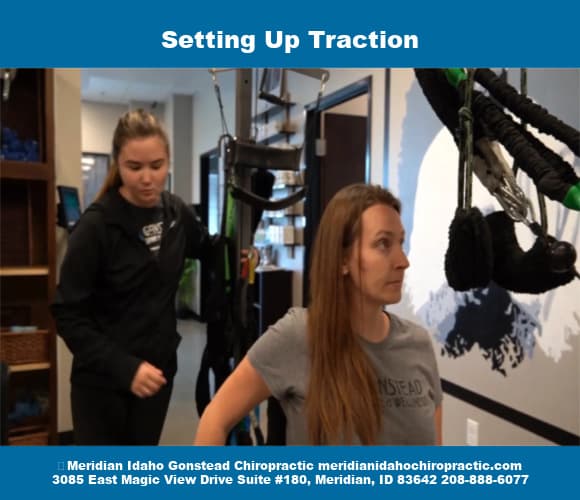 Image of Meridian Idaho Chiropractic staff with text stating setting up traction